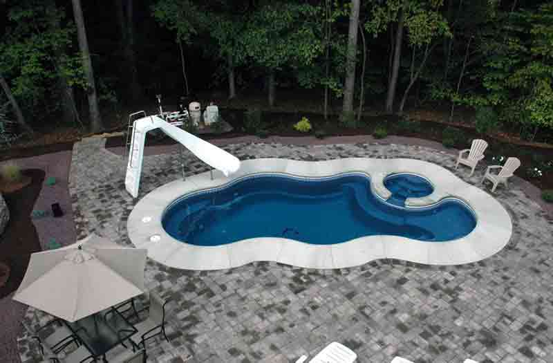 Laguna deluxe inground swimming pool 4' concrete surround and paver patio