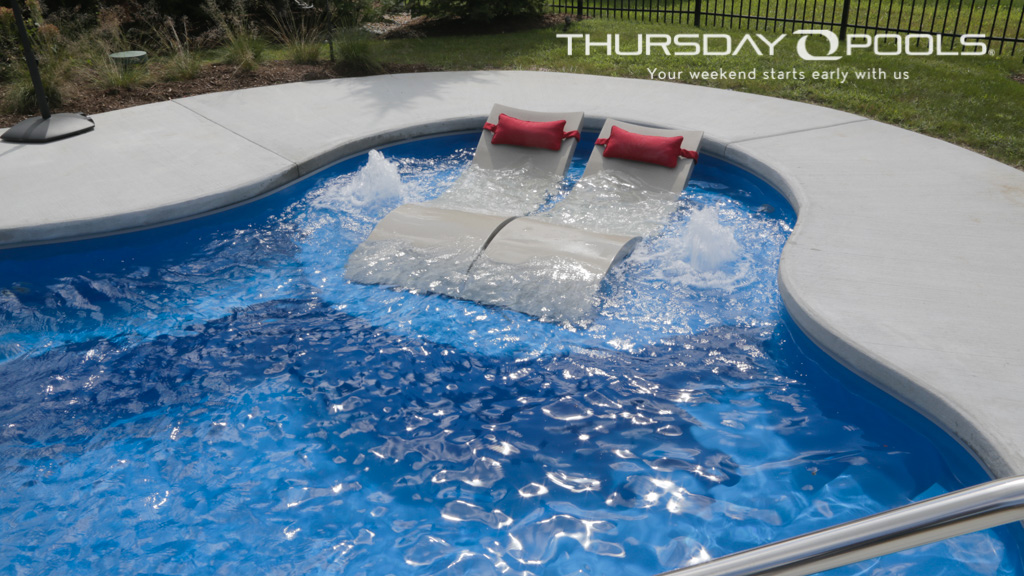 Tanning ledge image of the Well spring fiberglass swimming pool