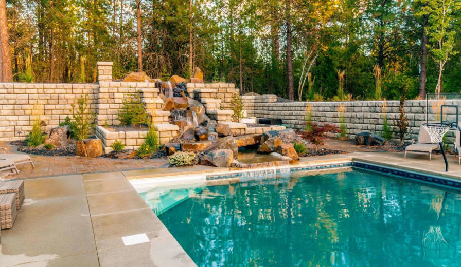 redi rock retaining wall for my pool area blue hawaiian pools of michigan img